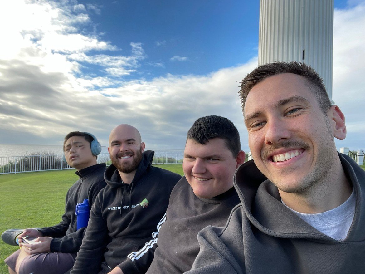 Support worker with participants enjoying the outdoors together